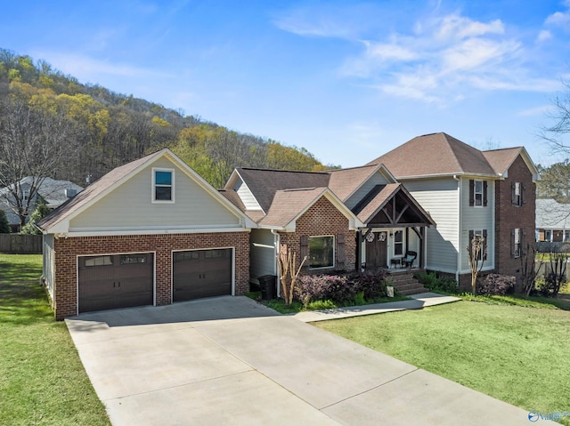 craftsman-style house featuring a front yard and a garage