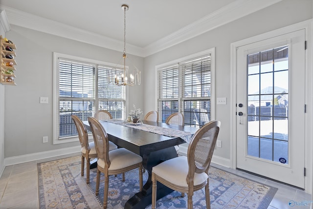 tiled dining room featuring crown molding, a wealth of natural light, and a chandelier