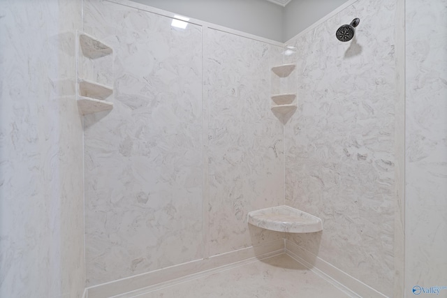 bathroom with a tile shower