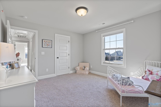 carpeted bedroom with multiple windows