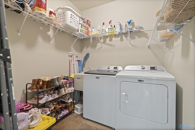 clothes washing area featuring separate washer and dryer