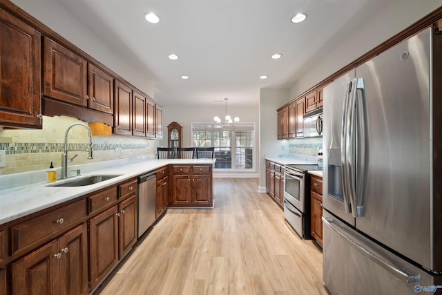 25 County Road 504, Centre, AL 35960 - kitchen featuring a sink, light countertops, stainless steel appliances, light wood-style flooring, and recessed lighting
