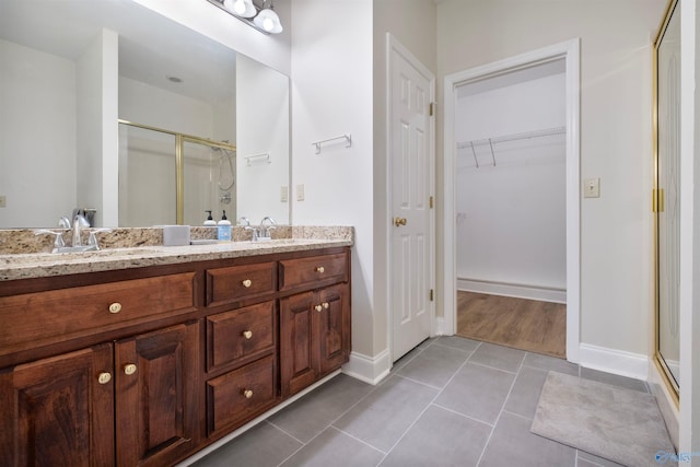 25 County Road 504, Centre, AL 35960 - full bath featuring a shower stall, tile patterned flooring, a sink, and double vanity