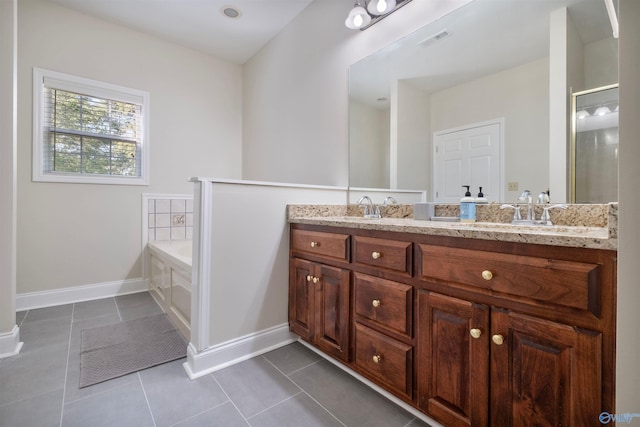 25 County Road 504, Centre, AL 35960 - bathroom featuring a garden tub, a sink, double vanity, tile patterned flooring, and visible vents