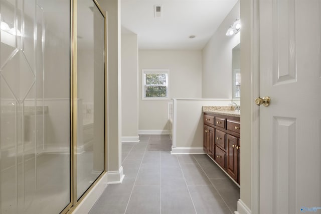 25 County Road 504, Centre, AL 35960 - bathroom featuring a stall shower, vanity, baseboards, tile patterned flooring, and visible vents