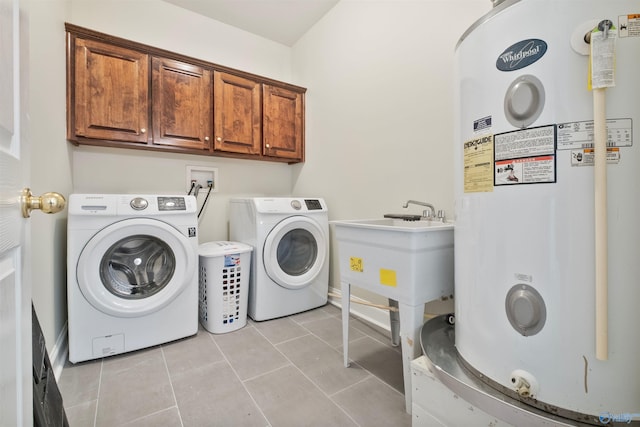 25 County Road 504, Centre, AL 35960 - clothes washing area with washing machine and clothes dryer, a sink, light tile patterned floors, water heater, and cabinet space