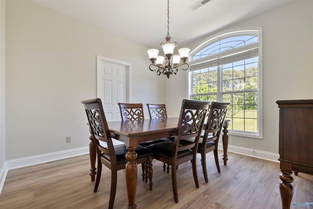 25 County Road 504, Centre, AL 35960 - dining area with visible vents, light wood finished floors, baseboards, and a notable chandelier