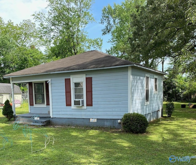 410 Ponroy St, Scottsboro, AL 35768 - view of property exterior featuring a lawn, cooling unit, and crawl space