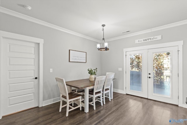 dining room featuring dark wood-style floors, french doors, ornamental molding, and visible vents