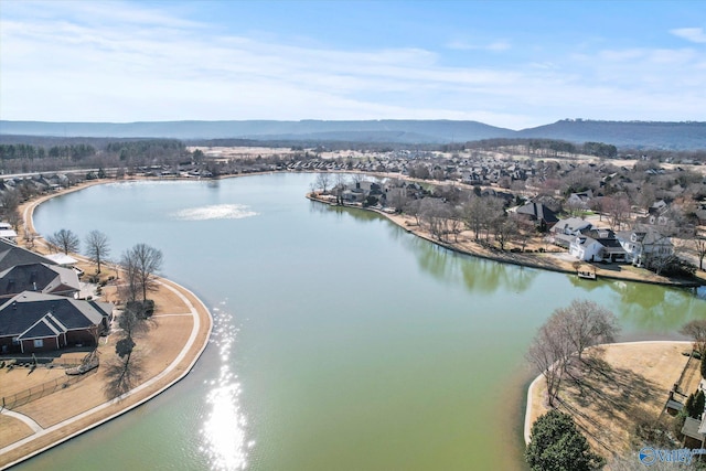 drone / aerial view with a residential view and a water and mountain view