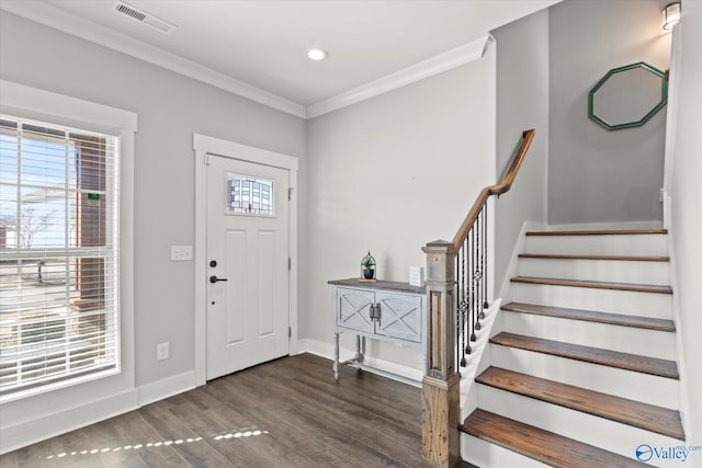 entryway featuring baseboards, visible vents, dark wood finished floors, stairway, and crown molding