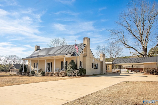 view of front of property with a carport and a porch