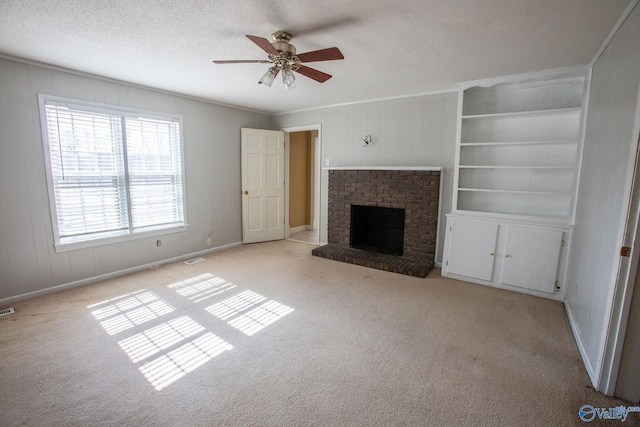 unfurnished living room with a fireplace, light carpet, and a textured ceiling