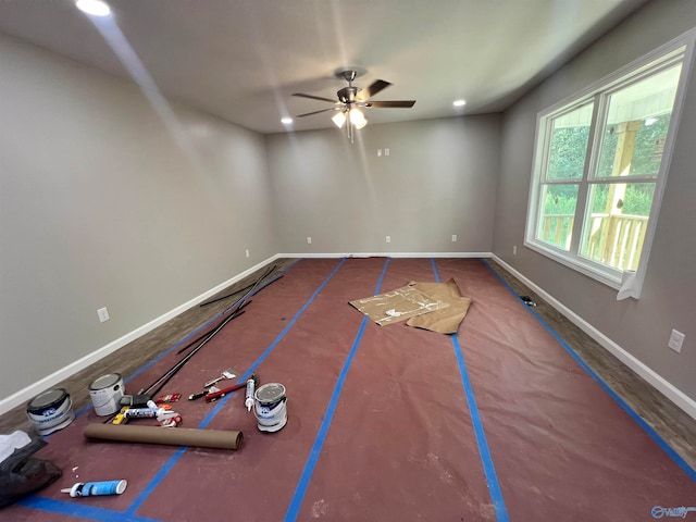 exercise room with ceiling fan