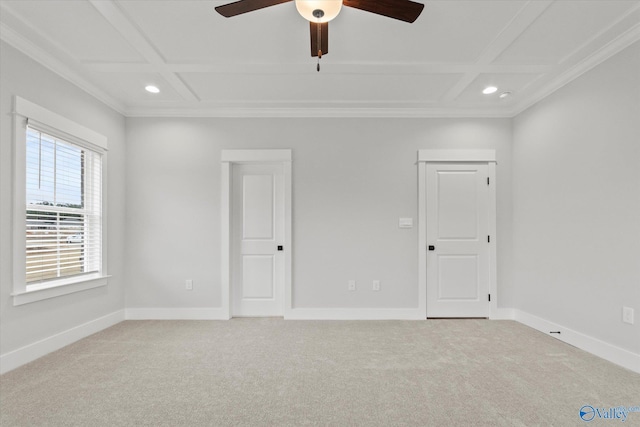 unfurnished room with light carpet, coffered ceiling, and ornamental molding