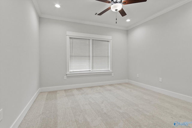 carpeted empty room featuring ceiling fan and ornamental molding