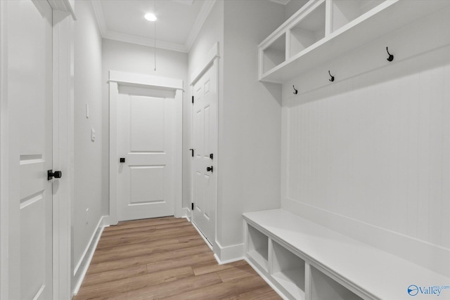 mudroom with light hardwood / wood-style floors and ornamental molding