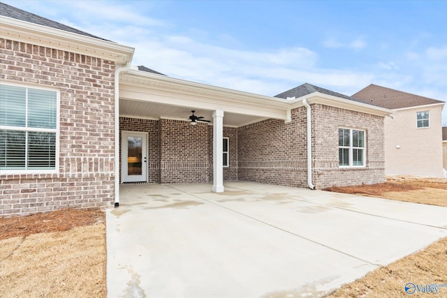 view of side of home featuring ceiling fan