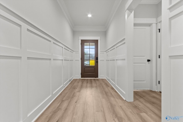 doorway featuring light hardwood / wood-style flooring and ornamental molding