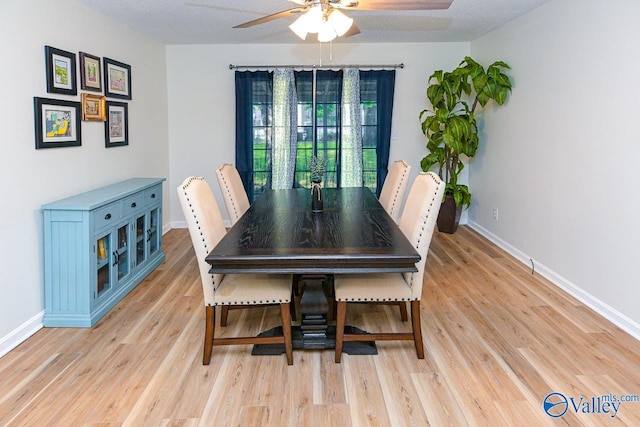 1409 8th Ave SE, Decatur, AL 35601 - dining room featuring ceiling fan, light wood-style flooring, and baseboards