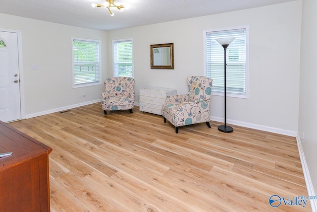 1409 8th Ave SE, Decatur, AL 35601 - living area with light wood-style flooring and baseboards