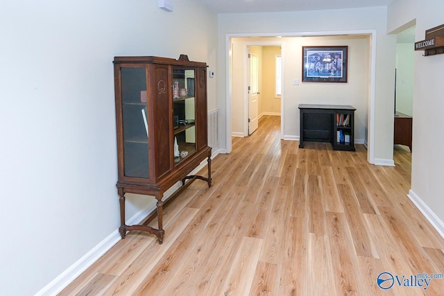 1409 8th Ave SE, Decatur, AL 35601 - hallway with light wood-type flooring and baseboards