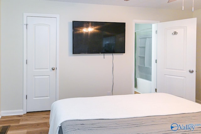 1409 8th Ave SE, Decatur, AL 35601 - bedroom featuring wood finished floors and baseboards