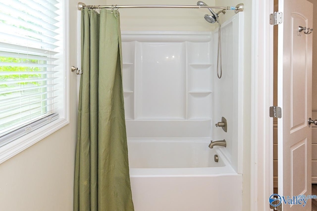 1409 8th Ave SE, Decatur, AL 35601 - bathroom with shower / tub combo with curtain