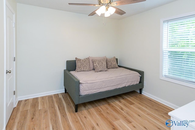 1409 8th Ave SE, Decatur, AL 35601 - bedroom featuring light wood-style floors, baseboards, and ceiling fan