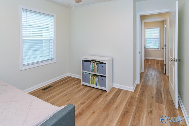 1409 8th Ave SE, Decatur, AL 35601 - bedroom with light wood finished floors and baseboards