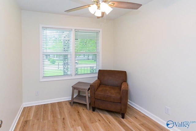 1409 8th Ave SE, Decatur, AL 35601 - sitting room featuring light wood-style floors, ceiling fan, and baseboards