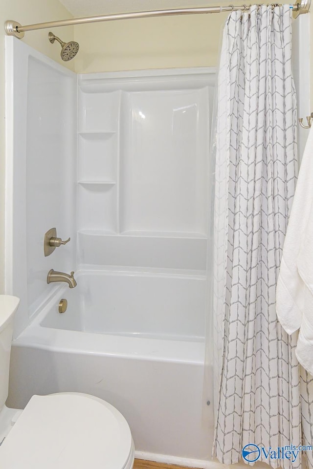1409 8th Ave SE, Decatur, AL 35601 - full bath featuring toilet and shower / bath combination with curtain