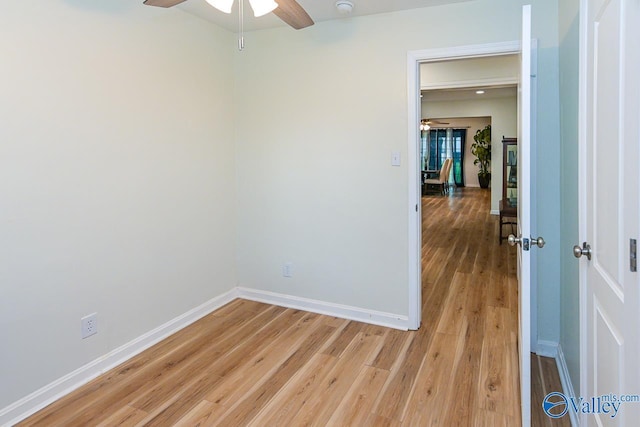 1409 8th Ave SE, Decatur, AL 35601 - empty room featuring a ceiling fan, light wood-style flooring, and baseboards