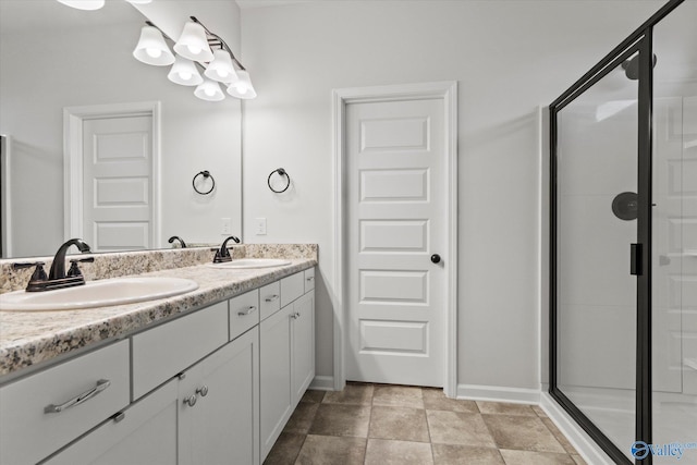18577 Cottontail Ln, Athens, AL 35613 - bathroom featuring double vanity, a sink, baseboards, and a stall shower