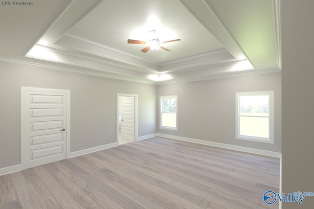 spare room with ceiling fan, ornamental molding, light hardwood / wood-style floors, and a tray ceiling