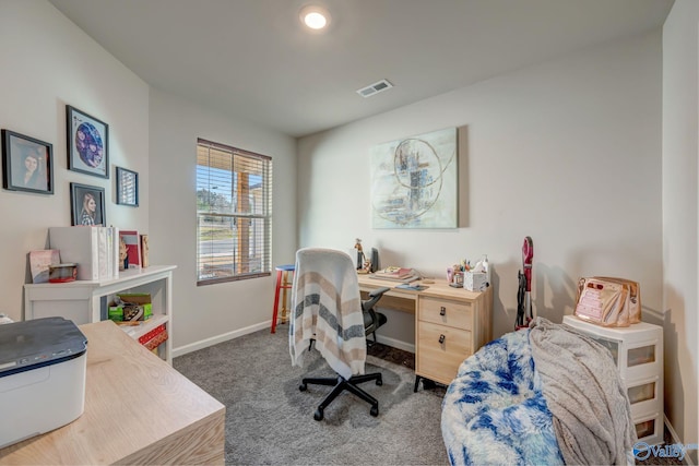 carpeted office with visible vents and baseboards