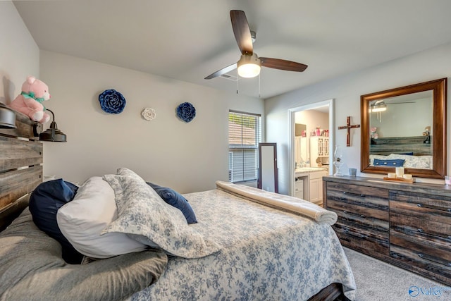 bedroom featuring connected bathroom, ceiling fan, and carpet floors