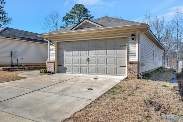 garage with concrete driveway