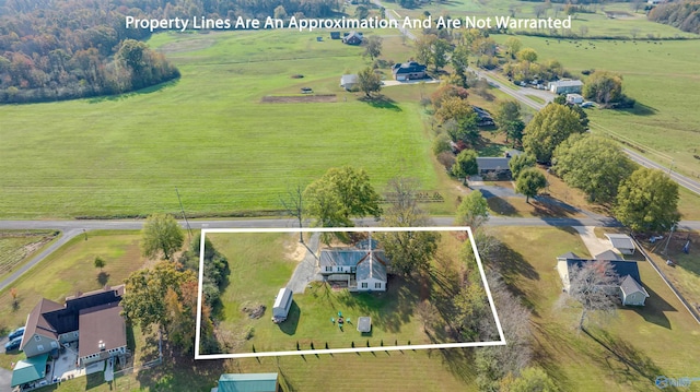 birds eye view of property featuring a rural view