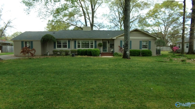 single story home with a front lawn and a chimney