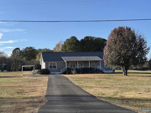 view of front of home featuring covered porch and a front yard