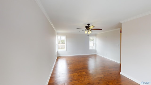 empty room with hardwood / wood-style flooring, crown molding, and ceiling fan