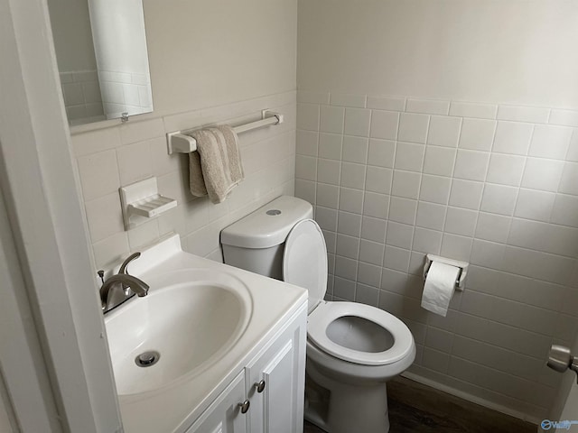 4503 Kenwood Dr, Huntsville, AL 35810 - bathroom with toilet, vanity, wood finished floors, and tile walls
