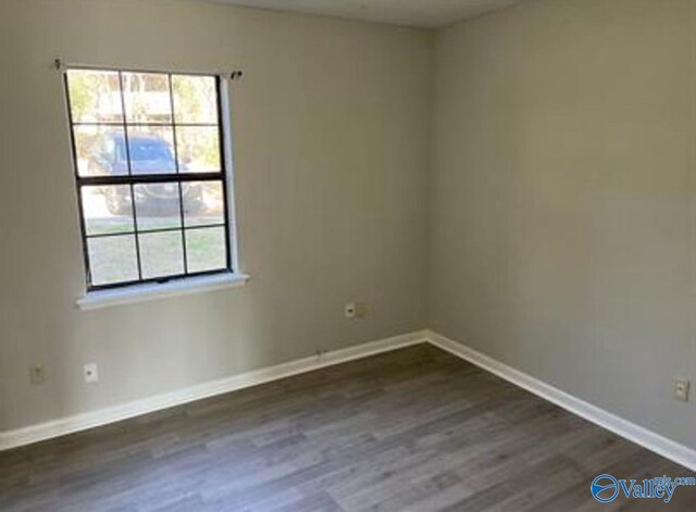 4922 Cotton Row NW, Huntsville, AL 35816 - spare room featuring dark wood-type flooring