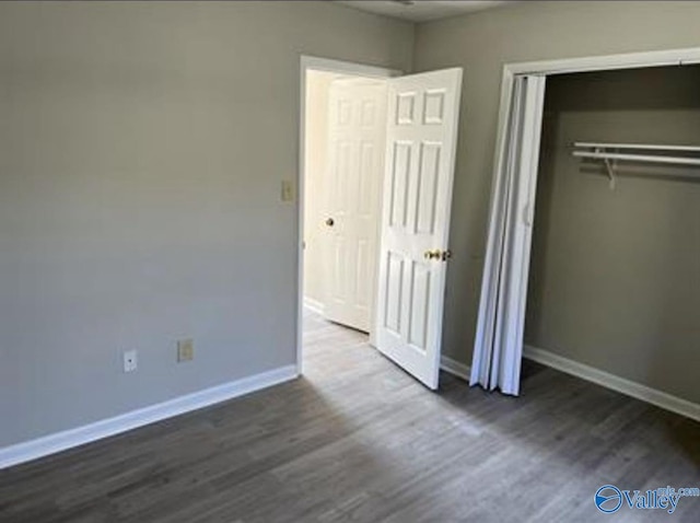 4922 Cotton Row NW, Huntsville, AL 35816 - unfurnished bedroom with dark wood-type flooring and a closet