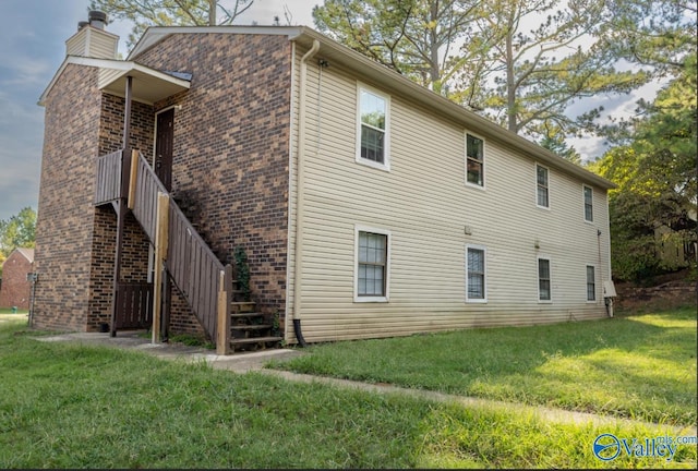 4922 Cotton Row NW, Huntsville, AL 35816 - rear view of house featuring a yard