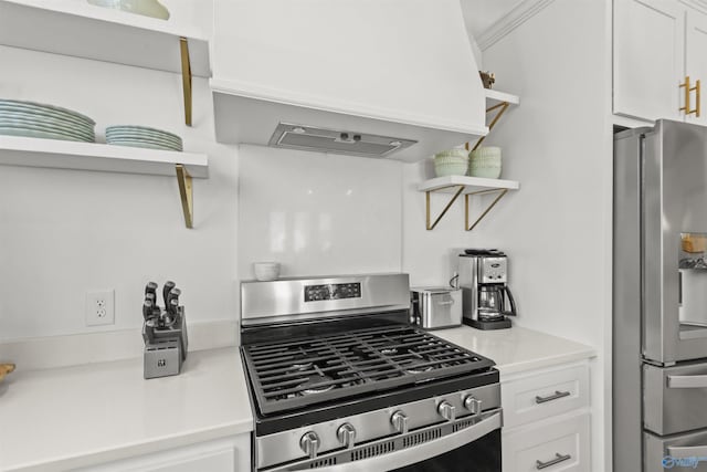 kitchen featuring custom exhaust hood, open shelves, light countertops, appliances with stainless steel finishes, and white cabinetry