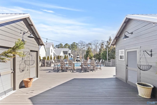 deck featuring a community pool