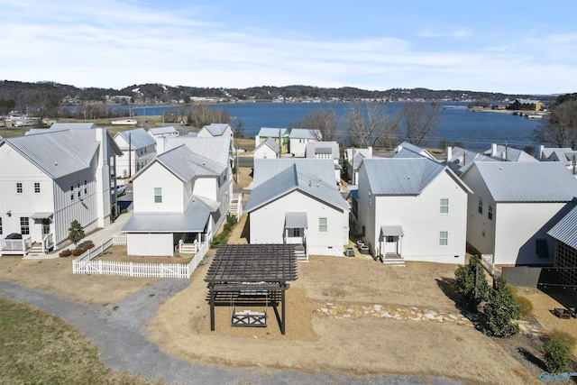 aerial view with a water view and a residential view