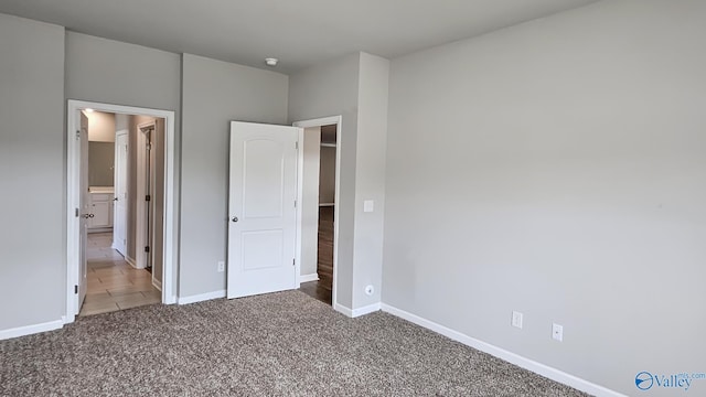 unfurnished bedroom featuring carpet